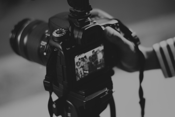 Photographer reviewing photoshoot photos